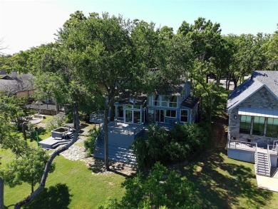 This unique lake home features large windows, offering on Lake Kiowa Golf Course in Texas - for sale on GolfHomes.com, golf home, golf lot