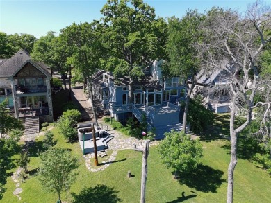This unique lake home features large windows, offering on Lake Kiowa Golf Course in Texas - for sale on GolfHomes.com, golf home, golf lot