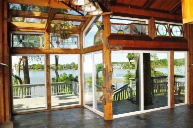 This unique lake home features large windows, offering on Lake Kiowa Golf Course in Texas - for sale on GolfHomes.com, golf home, golf lot
