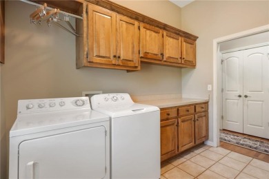 Perfectly situated on a premier golf course lot, this reverse 1 on Staley Farms Golf Club in Missouri - for sale on GolfHomes.com, golf home, golf lot
