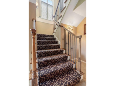 Perfectly situated on a premier golf course lot, this reverse 1 on Staley Farms Golf Club in Missouri - for sale on GolfHomes.com, golf home, golf lot