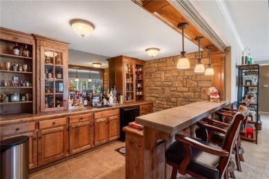 Perfectly situated on a premier golf course lot, this reverse 1 on Staley Farms Golf Club in Missouri - for sale on GolfHomes.com, golf home, golf lot