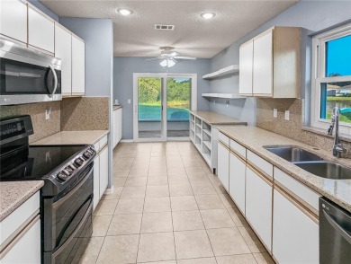 Under contract-accepting backup offers. Modern Comfort with on Falcon Watch Golf Club in Florida - for sale on GolfHomes.com, golf home, golf lot