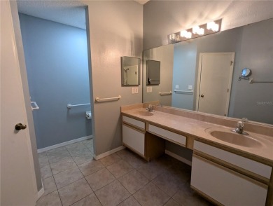 Under contract-accepting backup offers. Modern Comfort with on Falcon Watch Golf Club in Florida - for sale on GolfHomes.com, golf home, golf lot
