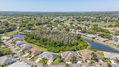 Under contract-accepting backup offers. Modern Comfort with on Falcon Watch Golf Club in Florida - for sale on GolfHomes.com, golf home, golf lot