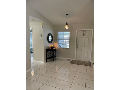 Beautiful updated Bermuda model villa  2 bedroom + den area on Cypress Lakes Golf Course - West Palm Beach in Florida - for sale on GolfHomes.com, golf home, golf lot