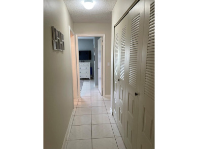 Beautiful updated Bermuda model villa  2 bedroom + den area on Cypress Lakes Golf Course - West Palm Beach in Florida - for sale on GolfHomes.com, golf home, golf lot