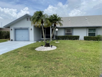 Beautiful updated Bermuda model villa  2 bedroom + den area on Cypress Lakes Golf Course - West Palm Beach in Florida - for sale on GolfHomes.com, golf home, golf lot