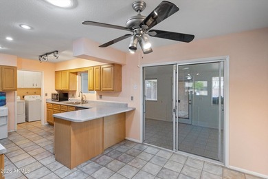 This charming Gemini twin home at 10229 N 108th Ave offers on Sun City Lakes West and East in Arizona - for sale on GolfHomes.com, golf home, golf lot