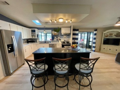 Come and ENJOY a Comfortable Serene Lifestyle ON THE WATER in a on Water Oak Country Club Estates in Florida - for sale on GolfHomes.com, golf home, golf lot