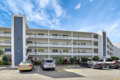 Charming 2-Bedroom, 2-Bathroom Condo in sought after Berkshire D on Hillsboro Pines Golf in Florida - for sale on GolfHomes.com, golf home, golf lot