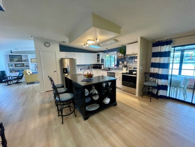 Come and ENJOY a Comfortable Serene Lifestyle ON THE WATER in a on Water Oak Country Club Estates in Florida - for sale on GolfHomes.com, golf home, golf lot