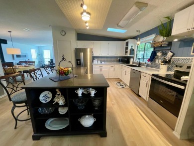 Come and ENJOY a Comfortable Serene Lifestyle ON THE WATER in a on Water Oak Country Club Estates in Florida - for sale on GolfHomes.com, golf home, golf lot