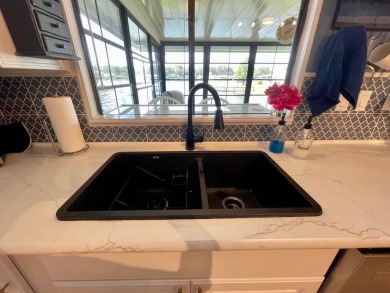 Come and ENJOY a Comfortable Serene Lifestyle ON THE WATER in a on Water Oak Country Club Estates in Florida - for sale on GolfHomes.com, golf home, golf lot