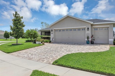 A Paver Driveway  Sidewalk welcome you to this Modern Affordable on Arlington Ridge Golf Club in Florida - for sale on GolfHomes.com, golf home, golf lot