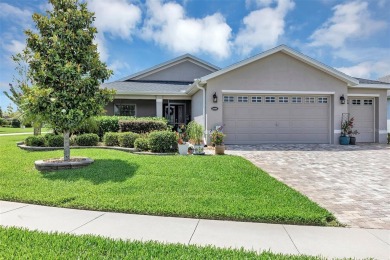 A Paver Driveway  Sidewalk welcome you to this Modern Affordable on Arlington Ridge Golf Club in Florida - for sale on GolfHomes.com, golf home, golf lot