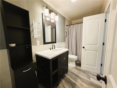 Nestled close to Dogwood Golf Course, this lovely end unit on Bella Vista Country Club and Golf Course in Arkansas - for sale on GolfHomes.com, golf home, golf lot