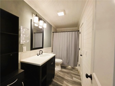 Nestled close to Dogwood Golf Course, this lovely end unit on Bella Vista Country Club and Golf Course in Arkansas - for sale on GolfHomes.com, golf home, golf lot