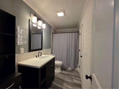 Nestled close to Dogwood Golf Course, this lovely end unit on Bella Vista Country Club and Golf Course in Arkansas - for sale on GolfHomes.com, golf home, golf lot