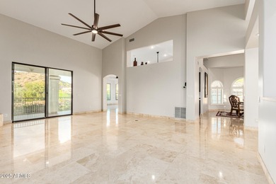 This stunning home is perfectly positioned on the Red Mountain on Red Mountain Ranch Country Club in Arizona - for sale on GolfHomes.com, golf home, golf lot