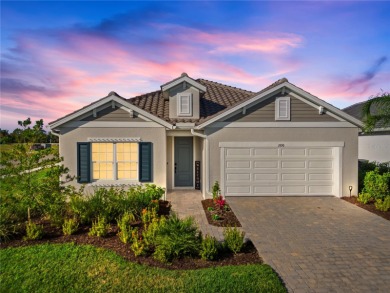 This beautiful Triumph model home by Neal Homes is in Waterside on The Founders Golf Club in Florida - for sale on GolfHomes.com, golf home, golf lot