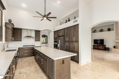 This stunning home is perfectly positioned on the Red Mountain on Red Mountain Ranch Country Club in Arizona - for sale on GolfHomes.com, golf home, golf lot