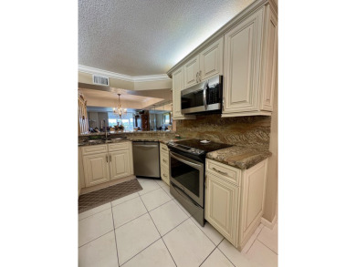 Welcome to this beautifully updated 2BR/2BA condo in the highly on Boca Dunes Golf and Country Club in Florida - for sale on GolfHomes.com, golf home, golf lot