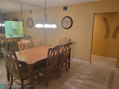 ELEGANT, IMMACULATE AND SPACIOUS UNIT WITH SERENE VIEWS OF GOLF on Wynmoor Golf Course in Florida - for sale on GolfHomes.com, golf home, golf lot