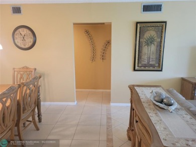 ELEGANT, IMMACULATE AND SPACIOUS UNIT WITH SERENE VIEWS OF GOLF on Wynmoor Golf Course in Florida - for sale on GolfHomes.com, golf home, golf lot