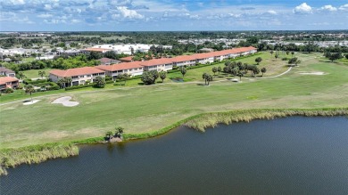 This 3 bedroom, 2 bath, ground level Mediterranean Style Villa on Twin Isles Country Club in Florida - for sale on GolfHomes.com, golf home, golf lot