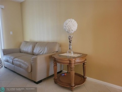 ELEGANT, IMMACULATE AND SPACIOUS UNIT WITH SERENE VIEWS OF GOLF on Wynmoor Golf Course in Florida - for sale on GolfHomes.com, golf home, golf lot