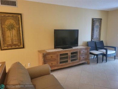 ELEGANT, IMMACULATE AND SPACIOUS UNIT WITH SERENE VIEWS OF GOLF on Wynmoor Golf Course in Florida - for sale on GolfHomes.com, golf home, golf lot