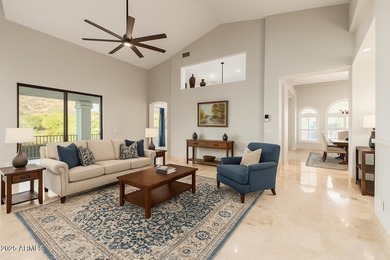 This stunning home is perfectly positioned on the Red Mountain on Red Mountain Ranch Country Club in Arizona - for sale on GolfHomes.com, golf home, golf lot