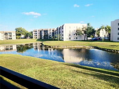 Welcome to serene lake views from this charming 2-bedroom, 1.5 on Sunrise Lakes Phase IV Golf Course in Florida - for sale on GolfHomes.com, golf home, golf lot