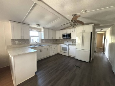 Here's a little slice a peace and happiness! Located on a on Golden Lakes Golf Course in Florida - for sale on GolfHomes.com, golf home, golf lot