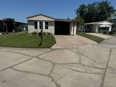 Here's a little slice a peace and happiness! Located on a on Golden Lakes Golf Course in Florida - for sale on GolfHomes.com, golf home, golf lot