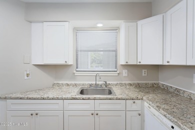 Welcome to this updated 2-bedroom, 2-bathroom ground floor condo on Belvedere Country Club in North Carolina - for sale on GolfHomes.com, golf home, golf lot