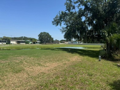 Here's a little slice a peace and happiness! Located on a on Golden Lakes Golf Course in Florida - for sale on GolfHomes.com, golf home, golf lot