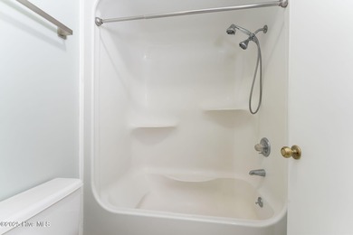 Welcome to this updated 2-bedroom, 2-bathroom ground floor condo on Belvedere Country Club in North Carolina - for sale on GolfHomes.com, golf home, golf lot