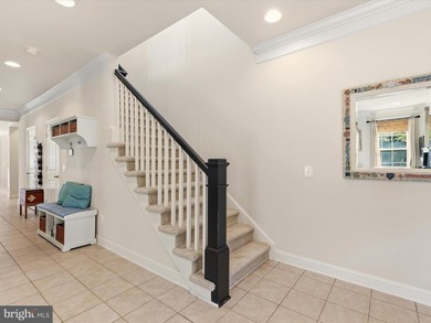 Welcome to 27444 S. Nicklaus Avenue, a refined coastal retreat on The Peninsula Golf and Country Club in Delaware - for sale on GolfHomes.com, golf home, golf lot