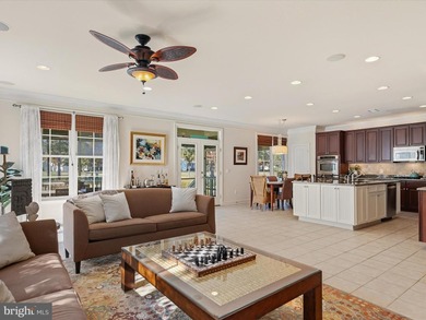 Welcome to 27444 S. Nicklaus Avenue, a refined coastal retreat on The Peninsula Golf and Country Club in Delaware - for sale on GolfHomes.com, golf home, golf lot