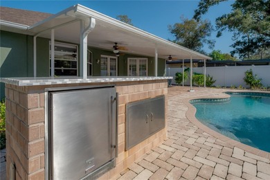 Welcome home to a place where comfort, craftsmanship, and calm on Temple Terrace Golf and Country Club in Florida - for sale on GolfHomes.com, golf home, golf lot