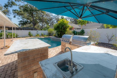 Welcome home to a place where comfort, craftsmanship, and calm on Temple Terrace Golf and Country Club in Florida - for sale on GolfHomes.com, golf home, golf lot