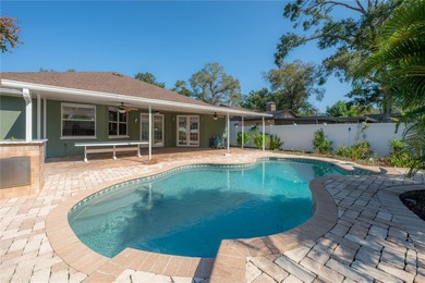 Welcome home to a place where comfort, craftsmanship, and calm on Temple Terrace Golf and Country Club in Florida - for sale on GolfHomes.com, golf home, golf lot