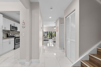 This lovely home overlooking the lake has been upgraded from on Boca Delray Golf and Country Club in Florida - for sale on GolfHomes.com, golf home, golf lot