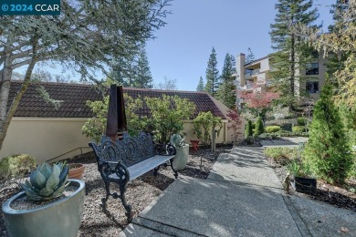 Nestled at the end of the drive, this rare end-unit level-in on Rossmoor Golf Course in California - for sale on GolfHomes.com, golf home, golf lot