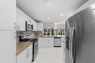 This lovely home overlooking the lake has been upgraded from on Boca Delray Golf and Country Club in Florida - for sale on GolfHomes.com, golf home, golf lot
