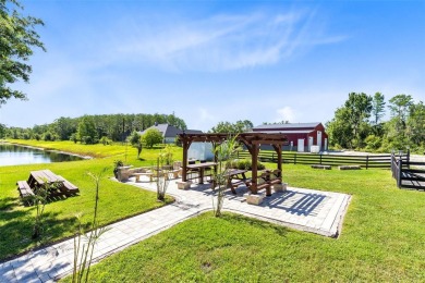 Welcome to your private retreat in the heart of Wedgefield, FL! on Wedgefield Golf Club in Florida - for sale on GolfHomes.com, golf home, golf lot
