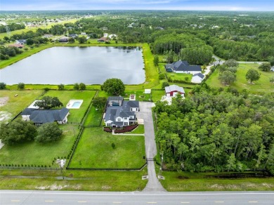 Welcome to your private retreat in the heart of Wedgefield, FL! on Wedgefield Golf Club in Florida - for sale on GolfHomes.com, golf home, golf lot