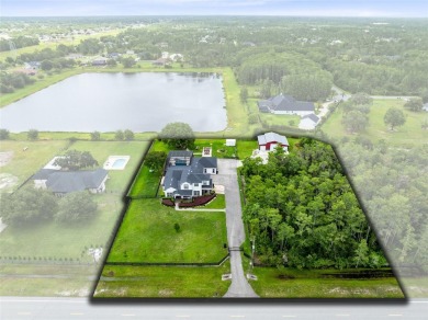 Welcome to your private retreat in the heart of Wedgefield, FL! on Wedgefield Golf Club in Florida - for sale on GolfHomes.com, golf home, golf lot